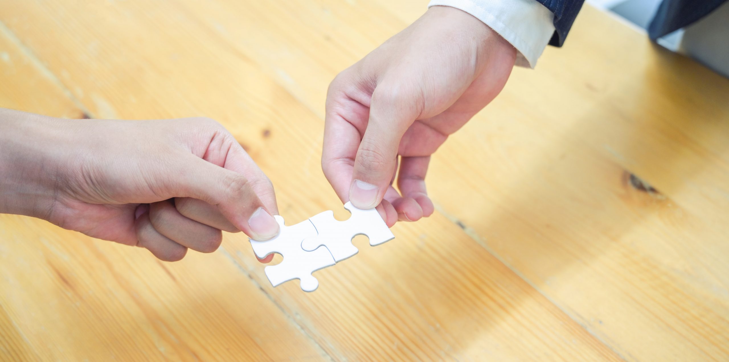 person-holding-white-jigsaw-puzzle-piece_by-bongkarn-thanyakij-on-Pexels-scaled